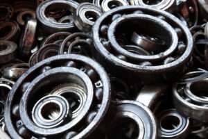Assortment of bearings including ball, roller, needle, thrust, and tapered roller bearings, showcasing diverse applications in different industries